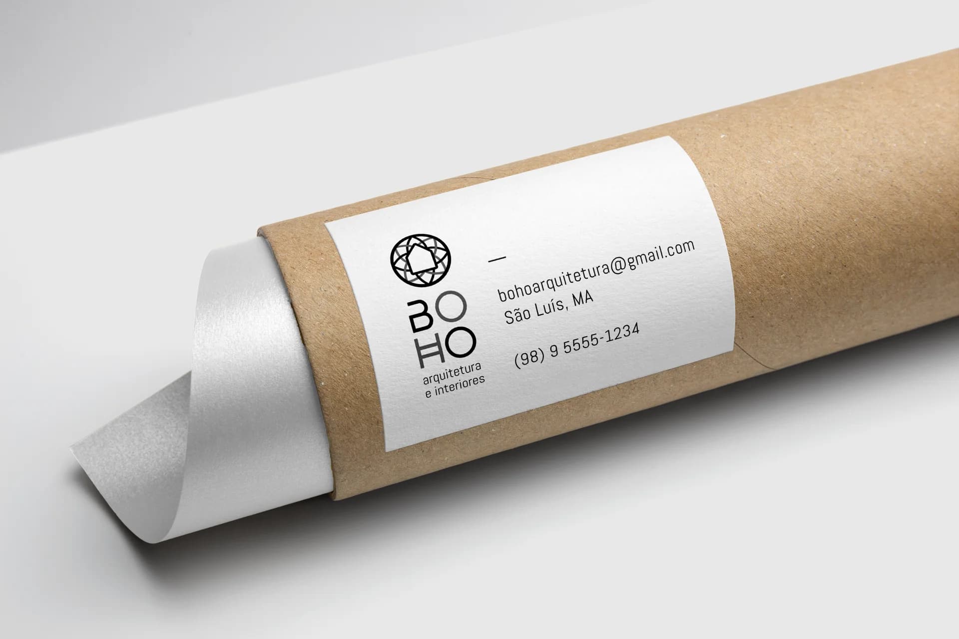 Kraft mailing tube with a white label showing the BOHO Arquitetura logo, email, São Luís MA address and phone number