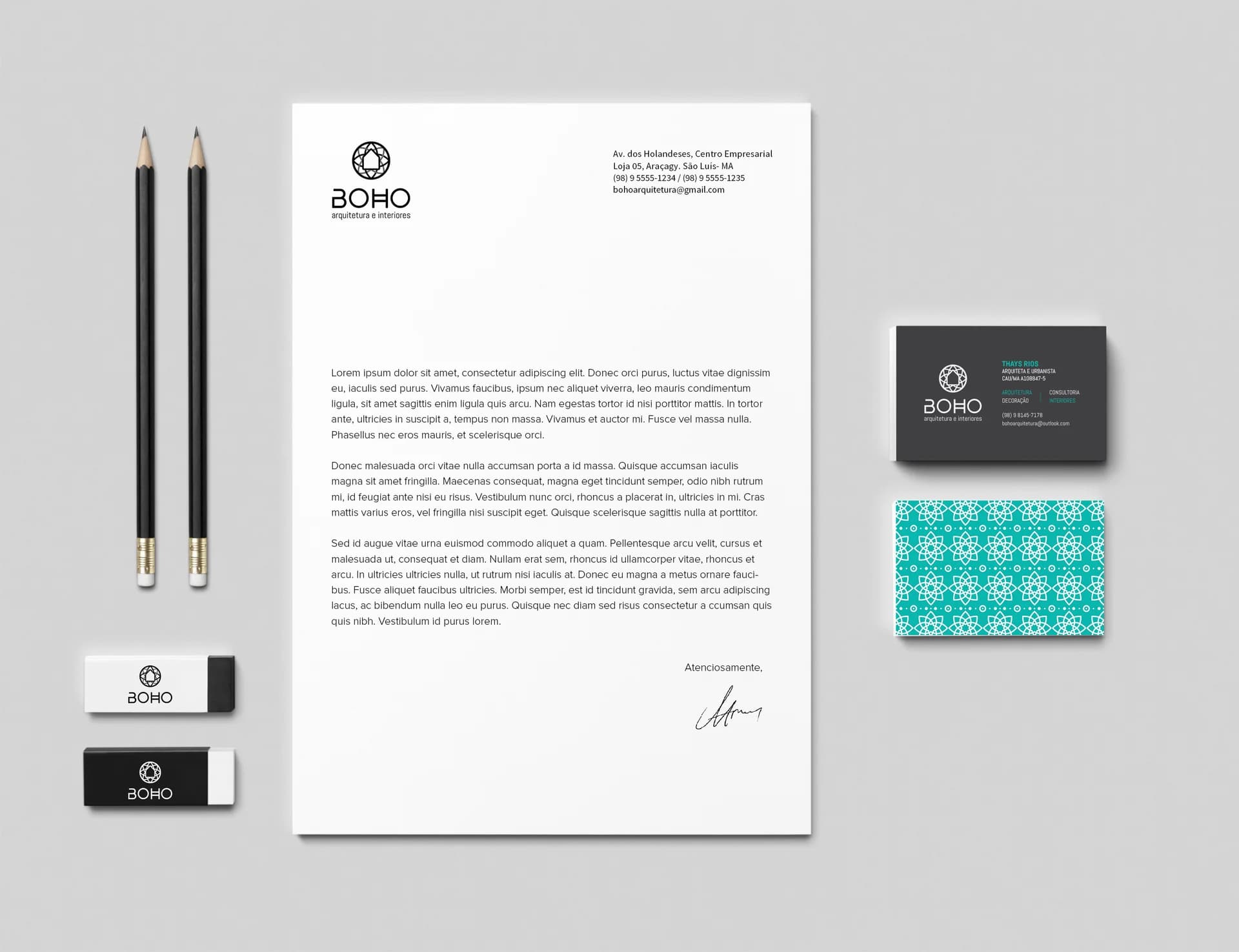 BOHO stationery: letterhead with logo, two black pencils, branded erasers, a dark business card and a teal patterned card on grey